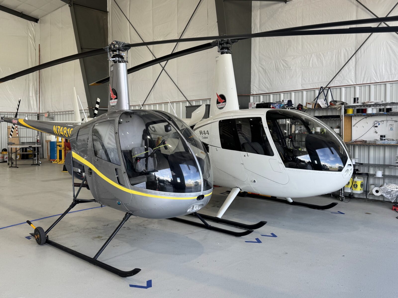 Robinson R22 and R44 helicopters in the Red Eagle hangar